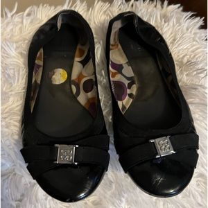 Coach slip on black shoes.